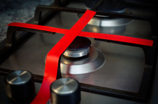 Stove burner crossed with red tape.