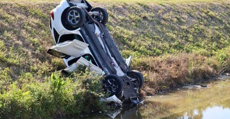 Car overturns into canal embankment, one person airlifted to trauma center