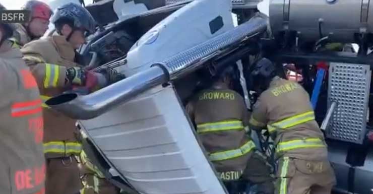 Driver hospitalized after semi-tractor trailer rolls over on Alligator Alley