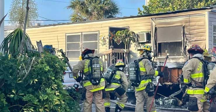 Firefighters battle blaze at Martin County mobile home, fear woman trapped inside