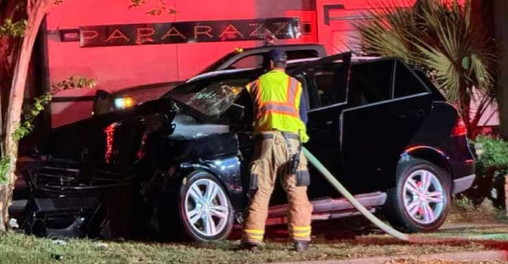Vehicle crashes into tree near Paparazzi Lounge in Downtown Pensacola