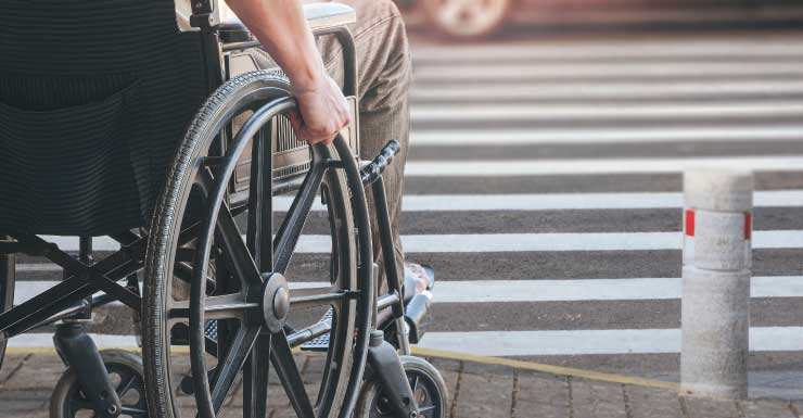 Woman in wheelchair hit by truck