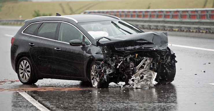 Woman dies after losing control of her car and crashing into concrete wall