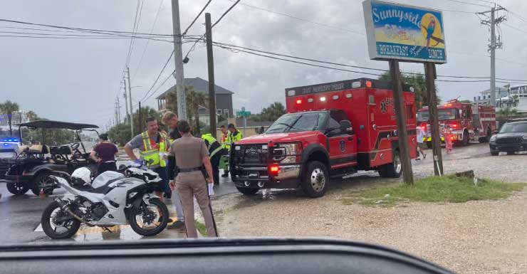 Law enforcement responding to golf cart and motorcycle crash in PCB
