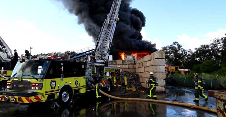 Firefighter injured as crews battle 3-alarm scrapyard blaze in Tampa