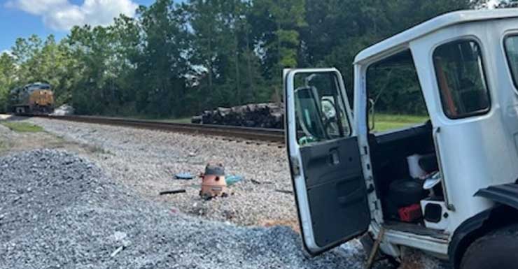 Train and garbage truck collide in Escambia County, 1 person hospitalized