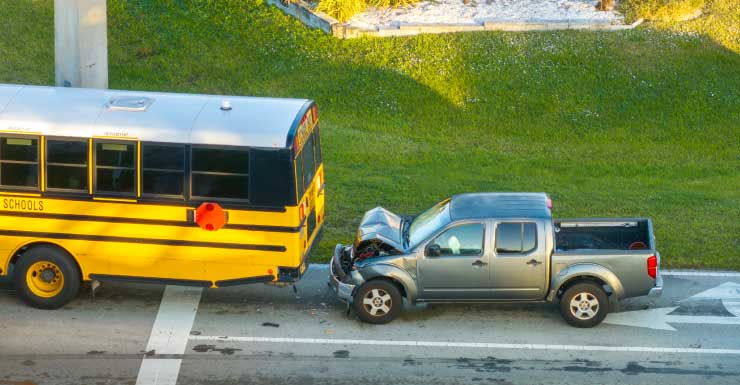 Woman accused of DUI crash involving school bus with her child in the passenger seat