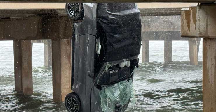 Driver swims to safety after car flips off of Bob Sikes bridge into water