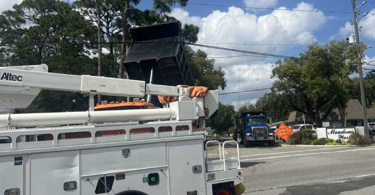 Dump truck hits power lines in Longwood, traffic rerouted