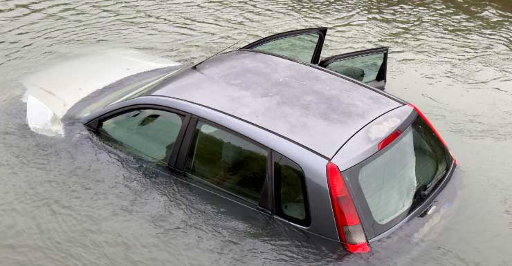 Roads close after car crashes into canal in Clewiston