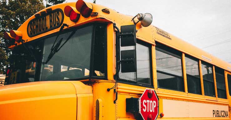 School bus with children on board collides with pickup truck