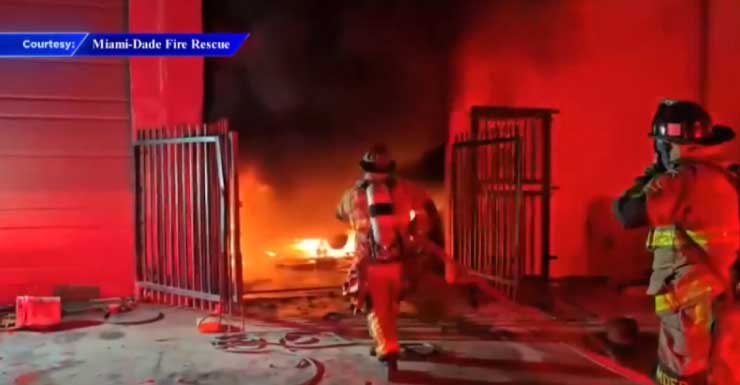 Man rushed to hospital after auto shop erupts in flames in Opa-locka