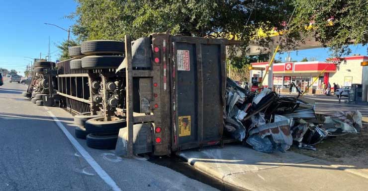 Tractor trailer hauling scrap metal overturns near Circle K in Escambia County