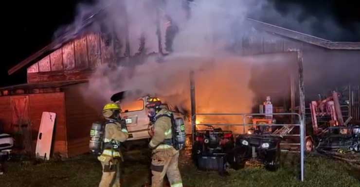 Alachua County firefighters put out large barn, vehicle fire