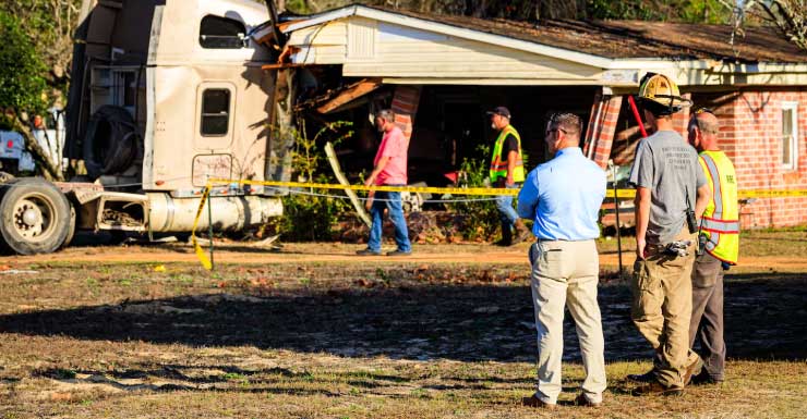 Logging truck crashes into vacant home in Holmes, Walton officials respond