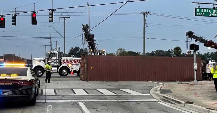 Shipping container falls off truck, takes out traffic light in Hillsborough County