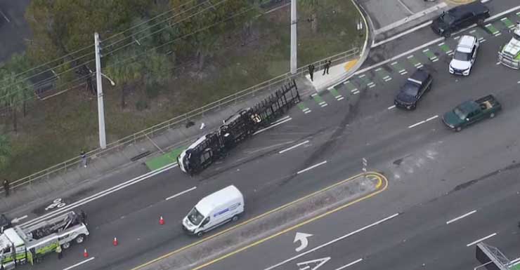 Trailer carrying vehicles rolls over in Davie, causing traffic backups
