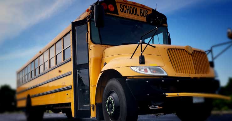 Pickup truck driver flees after hitting school bus in Levy County