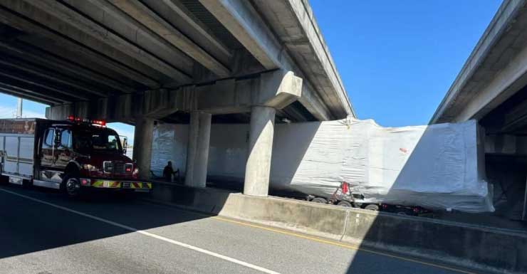 Truck strikes I-75 overpass, congesting traffic nearby to standstill