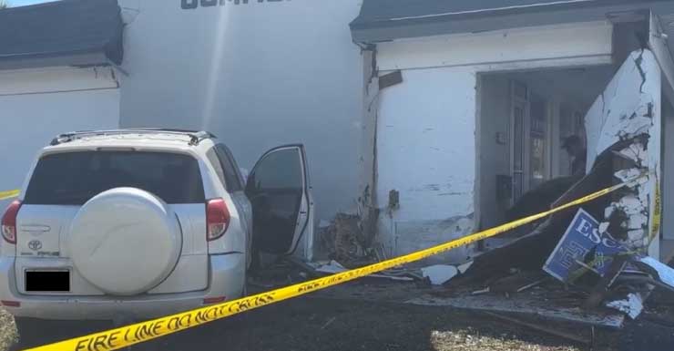 Two-vehicle crash sends SUV into building at Kenwood Commons plaza in Villas