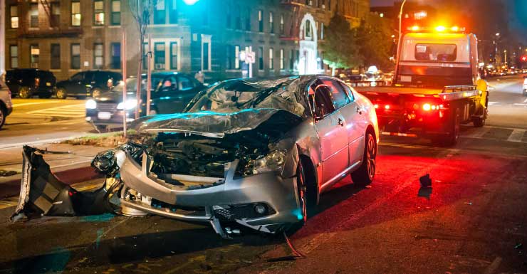 Driver rushed to hospital with burns after hitting pole in Liberty City, sparking fire