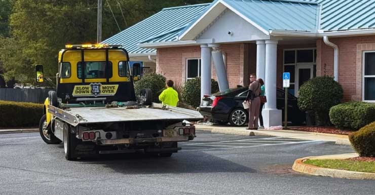 Pedestrian seriously injured after car crashes into Escambia County credit union