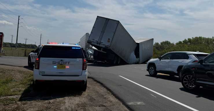 Semi-truck tips over on SR-710, prompting traffic reroutes and safety calls