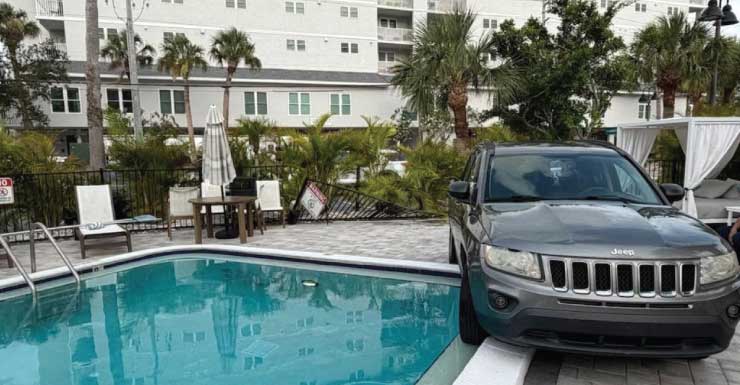 Jeep loses control, crashes through fence, stops just short of pool: CPD