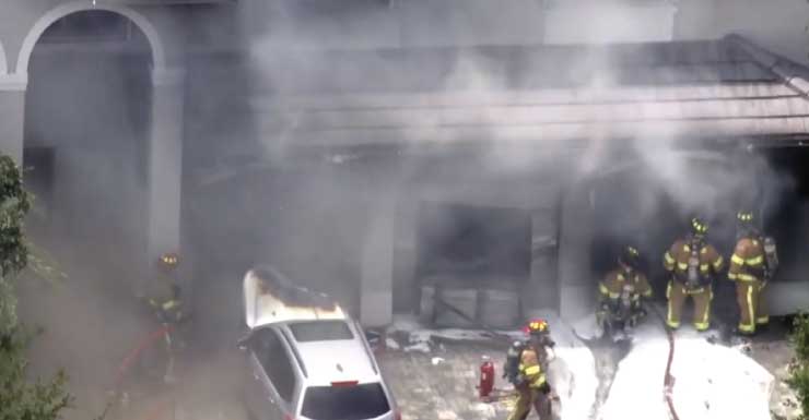2 people OK after cars inside Weston home garage erupt in flames