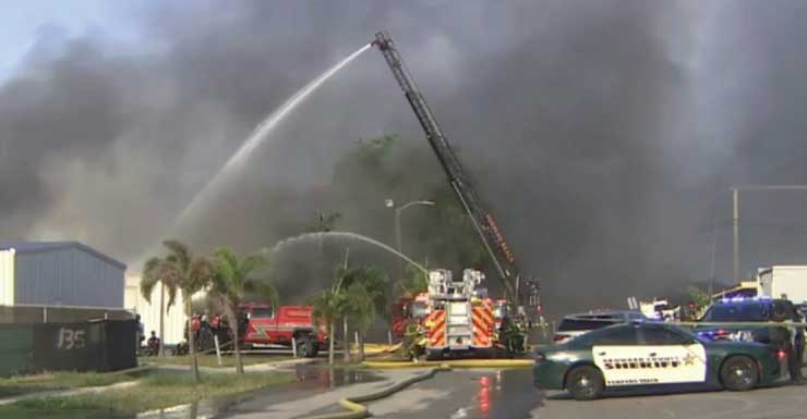 Fire crews battle massive warehouse blaze in Pompano Beach neighborhood