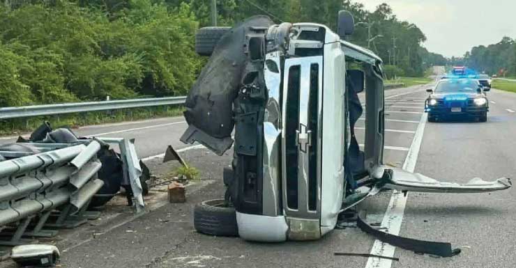 Man injured after pickup hits guardrail, overturns in Escambia County