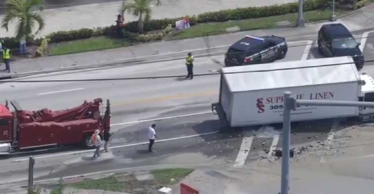 Semi-truck falls into sinkhole after water main break in Opa-locka