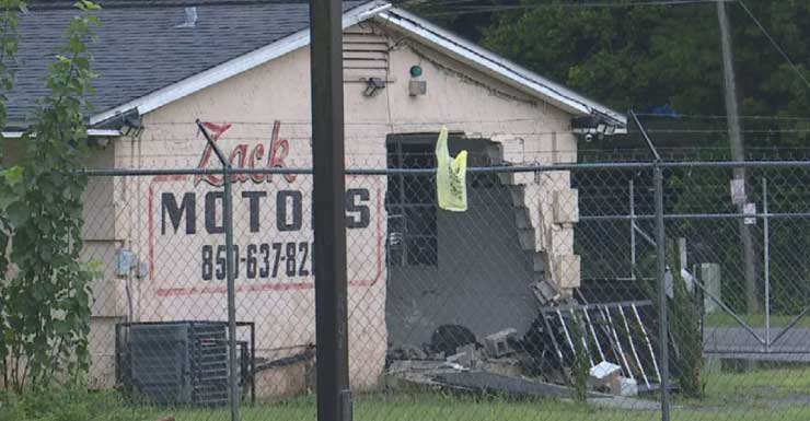 Car crashes through fence into used car dealership in Pensacola
