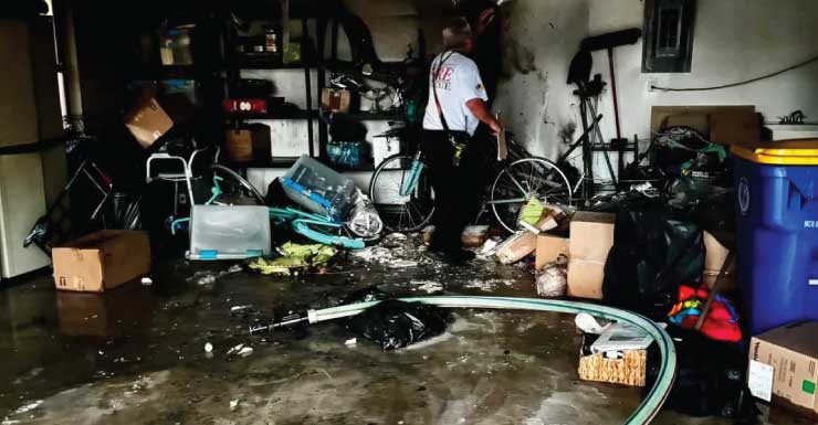 Dog, 2 people evacuated after lithium-ion battery sparks Jensen Beach garage fire