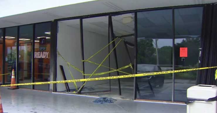 Driver hospitalized after crashing into building in Sunrise