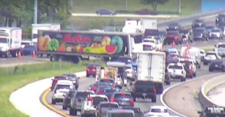 Semitruck jackknifed in I-75 median causes traffic backups near Alico Road in Lee County