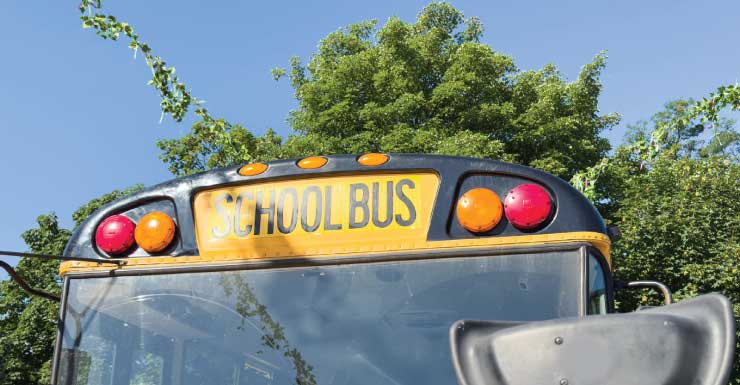 School bus carrying Centennial High students crashes into utility pole